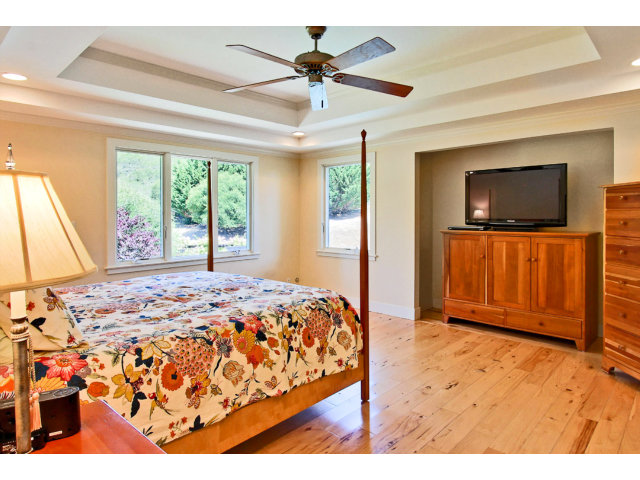 1020 Pleasant Valley Road Aptos, CA 95003 - Photo 12 of 25 a bedroom with a bed and a flat screen tv