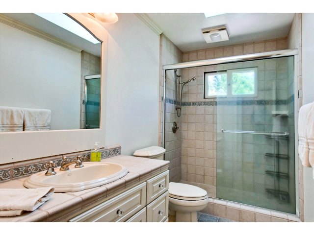 1020 Pleasant Valley Road Aptos, CA 95003 - Photo 16 of 25 a bathroom with a sink a toilet and shower