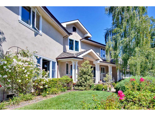 1020 Pleasant Valley Road Aptos, CA 95003 - Photo 2 of 25 a front view of a house with a yard and potted plants
