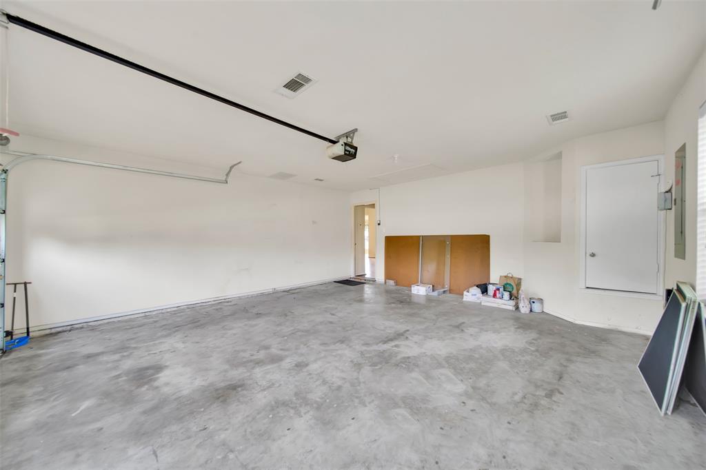 4221 Fiste Denton, TX 76207 - Photo 24 of 26 Garage featuring a garage door opener