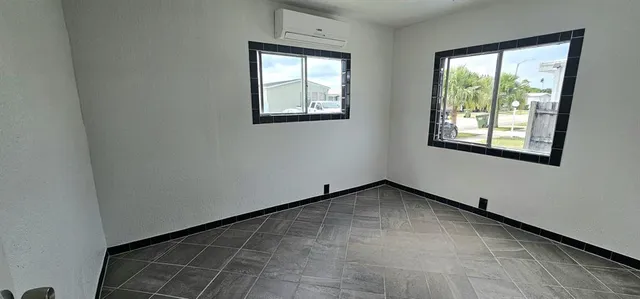 an empty room with windows