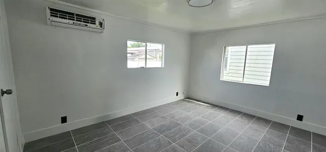 an empty room with windows