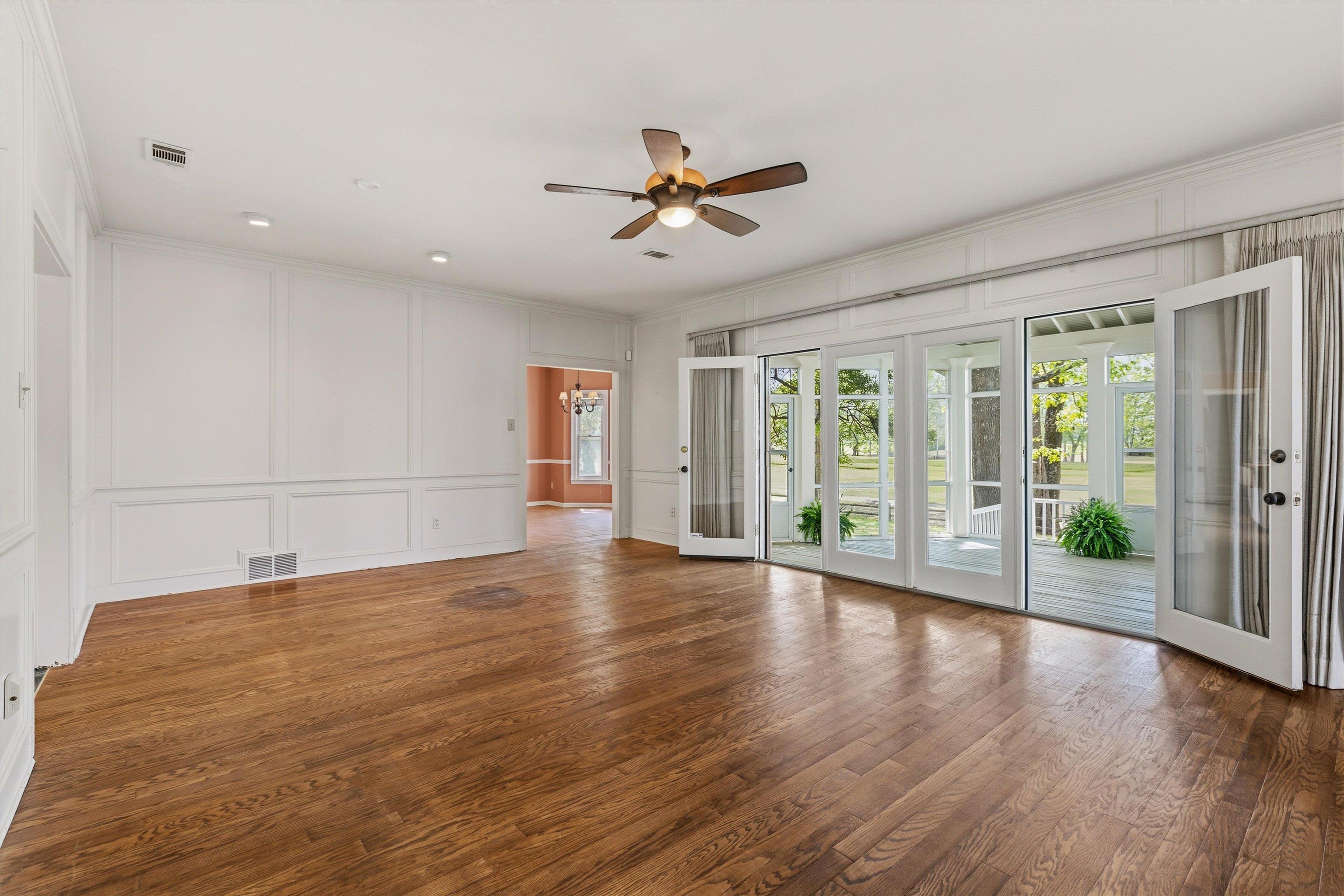 2783 West Levee Oaks Collierville, TN 38017 - Photo 13 of 40 a view of an empty room with a window and wooden floor
