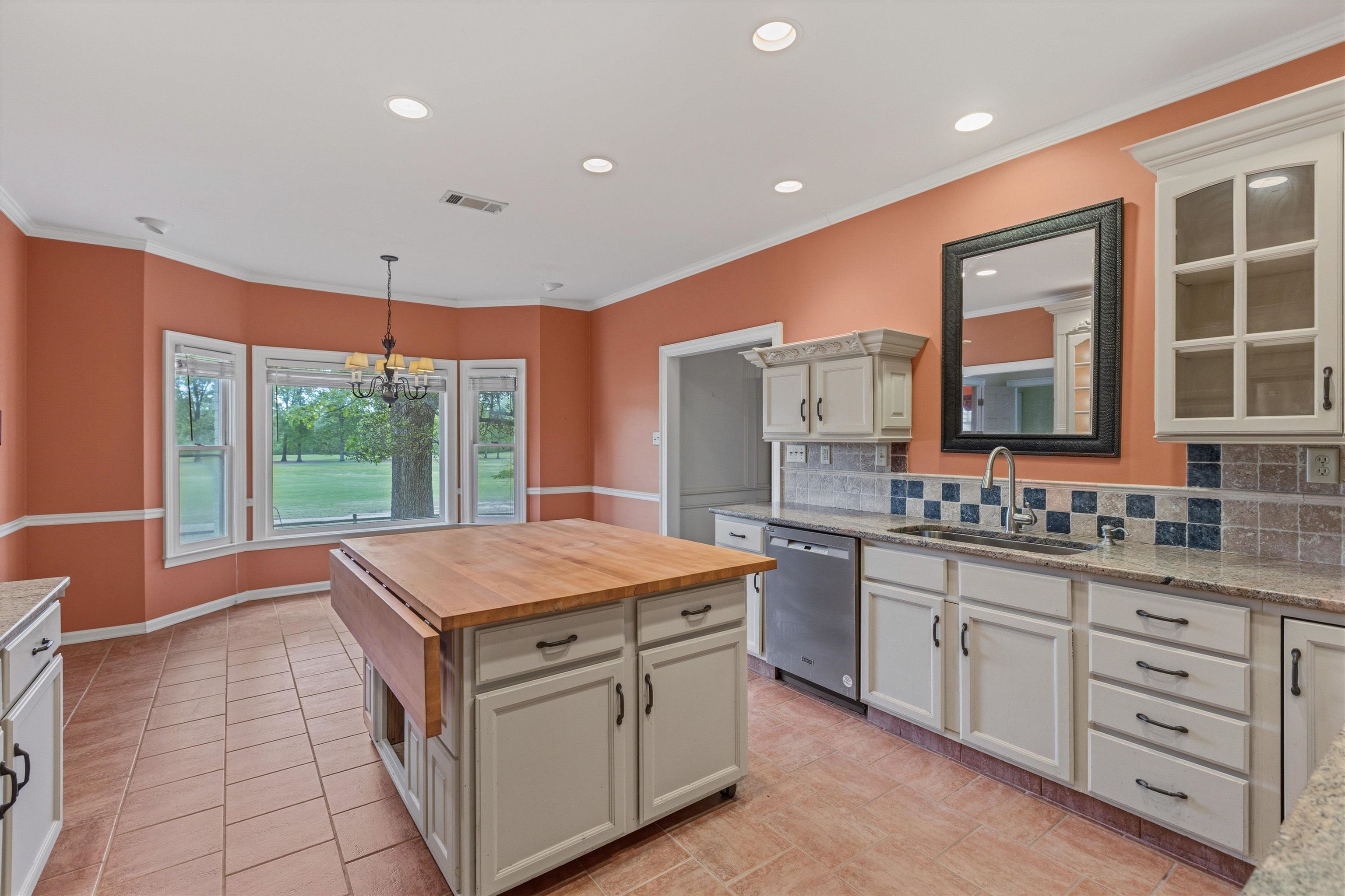 2783 West Levee Oaks Collierville, TN 38017 - Photo 18 of 40 a kitchen with stainless steel appliances granite countertop a stove and a sink