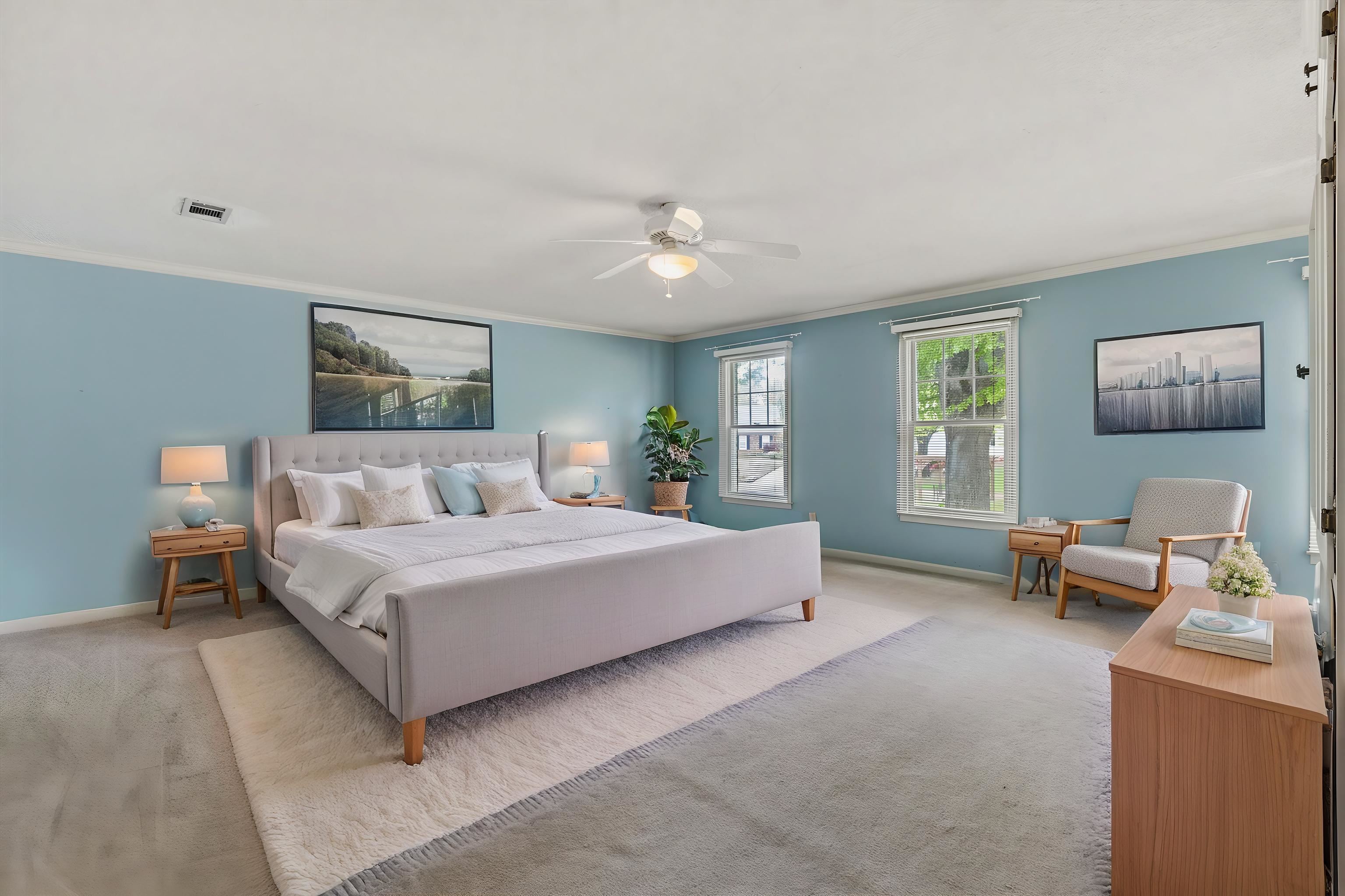 2783 West Levee Oaks Collierville, TN 38017 - Photo 24 of 40 a spacious bedroom with a bed a couch and a window
