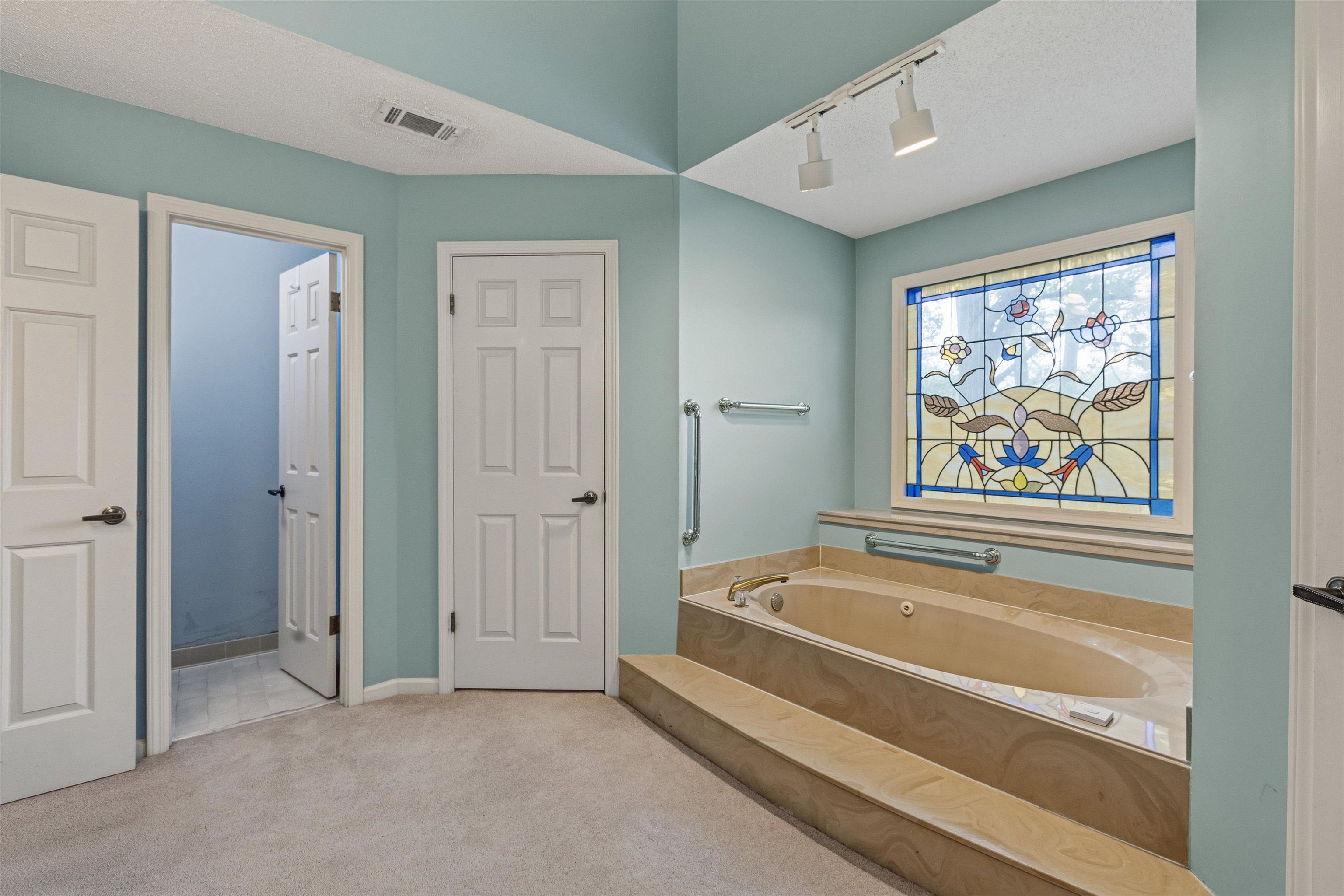 2783 West Levee Oaks Collierville, TN 38017 - Photo 28 of 40 a spacious bathroom with a bathtub and shower