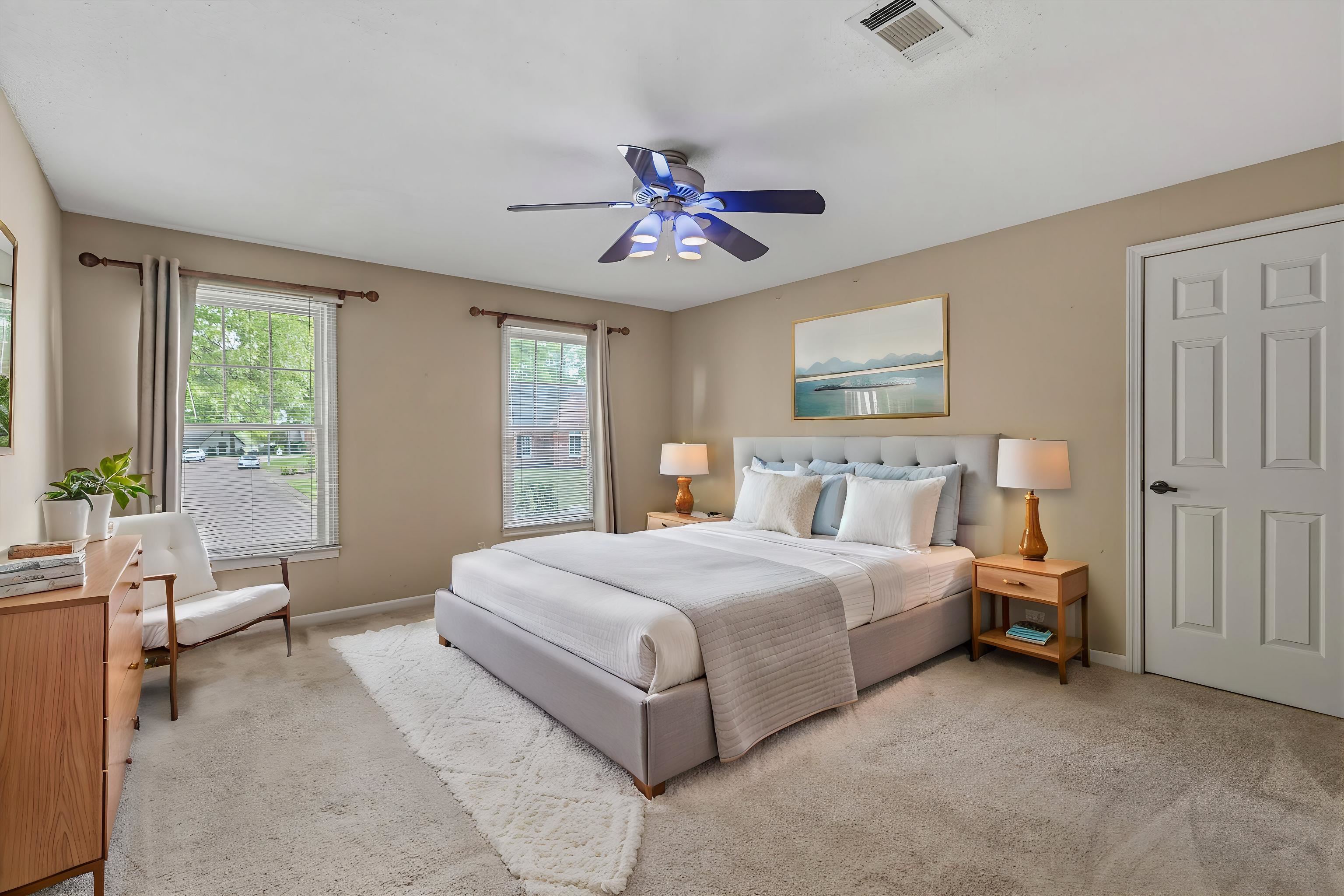 2783 West Levee Oaks Collierville, TN 38017 - Photo 29 of 40 a bedroom with a large bed and a chandelier