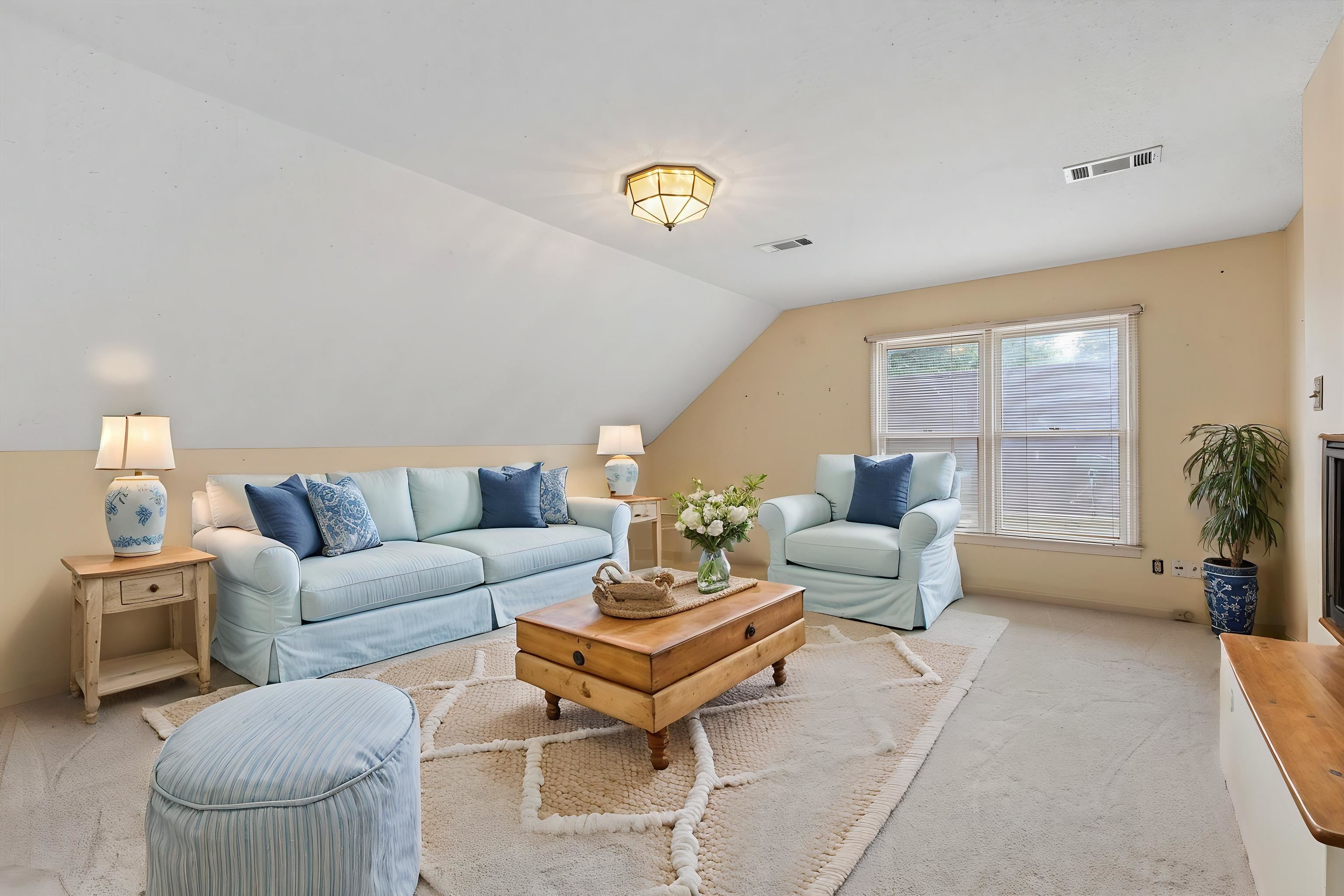 2783 West Levee Oaks Collierville, TN 38017 - Photo 32 of 40 a living room with furniture and a chandelier