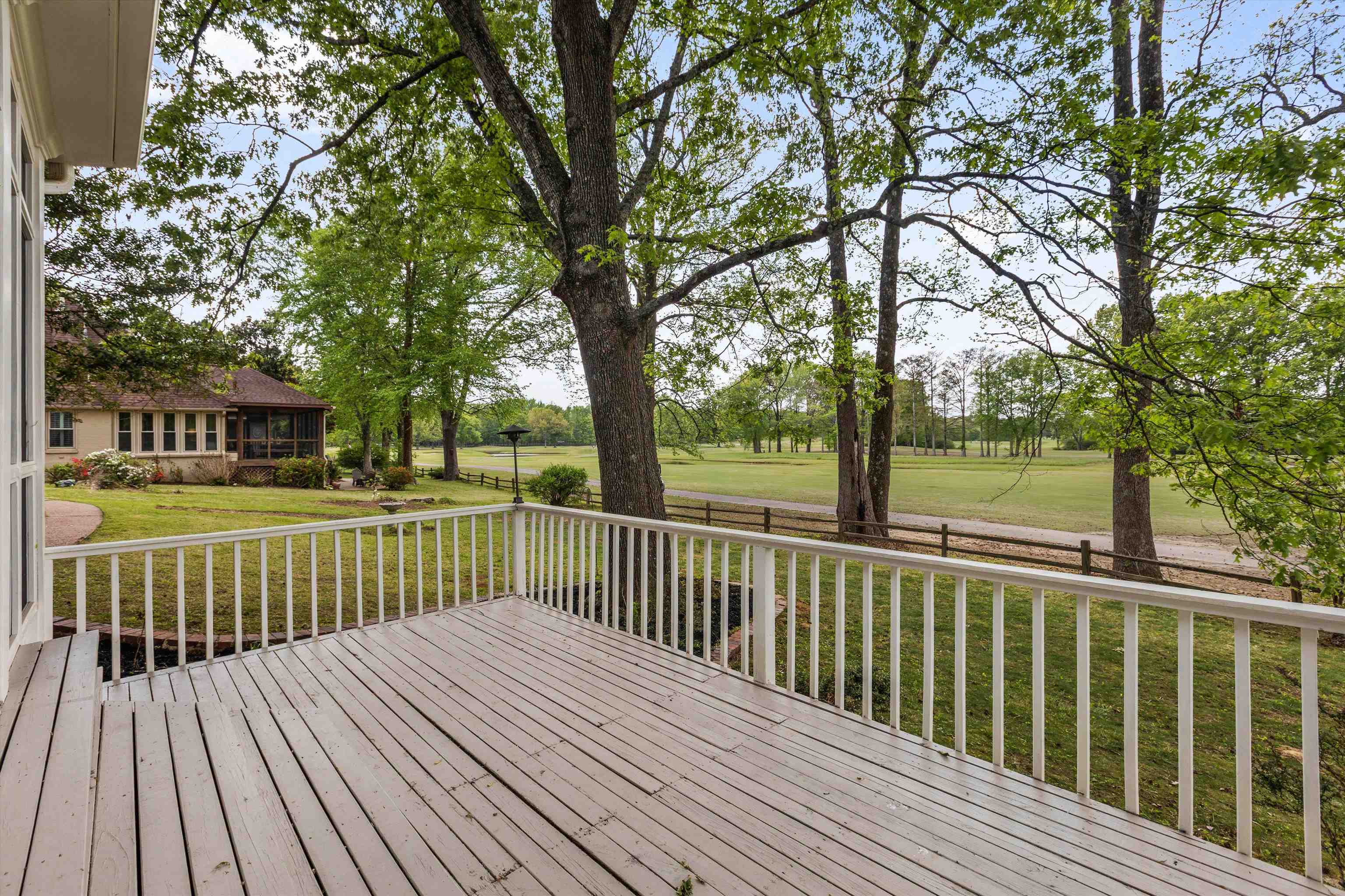 2783 West Levee Oaks Collierville, TN 38017 - Photo 6 of 40 a view of a wooden deck with a large trees