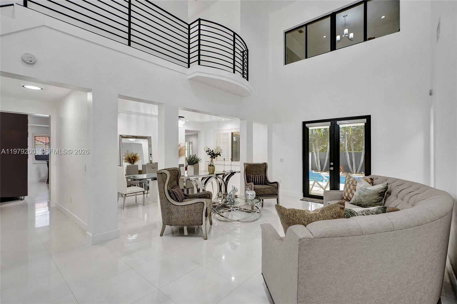 13676 Southwest 33rd Terrace Miami, FL 33175 - Photo 11 of 90 a living room with furniture and a table