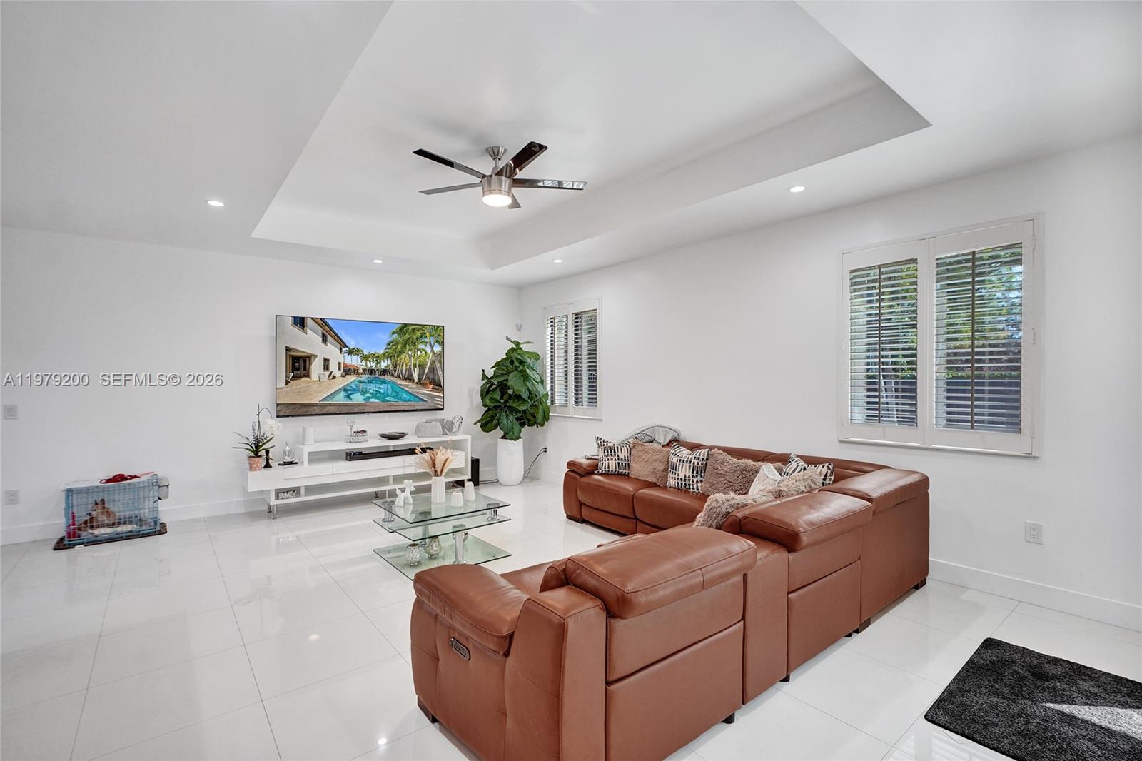 13676 Southwest 33rd Terrace Miami, FL 33175 - Photo 15 of 90 a living room with furniture and a flat screen tv