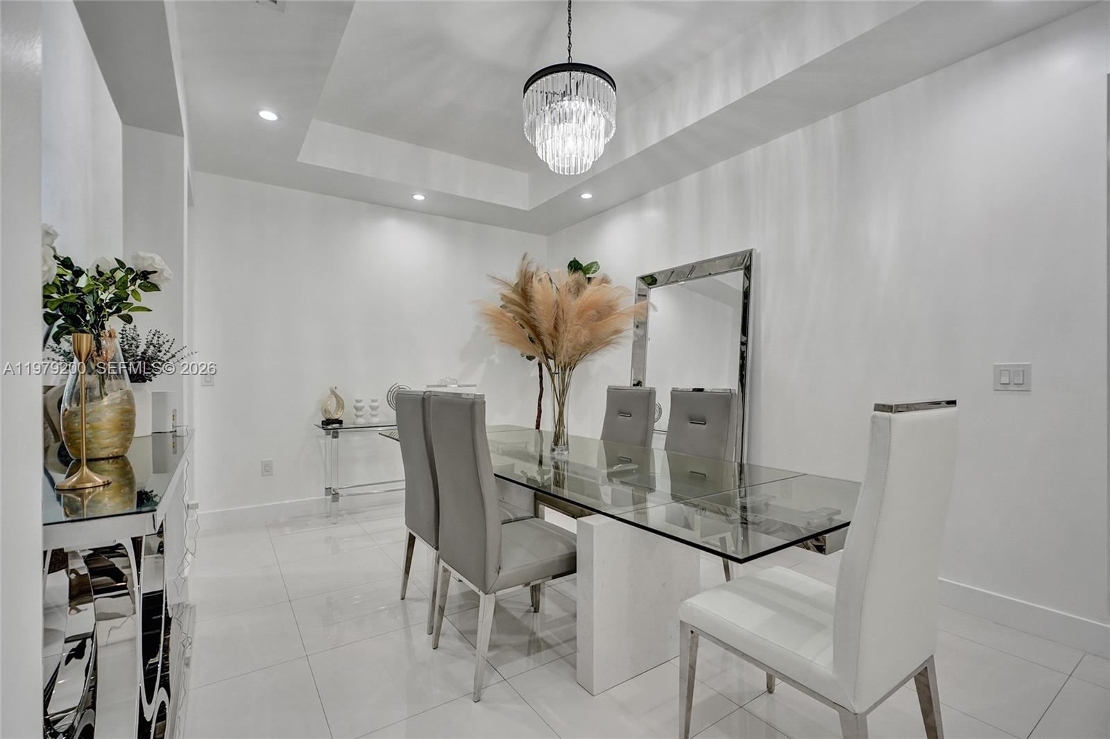 13676 Southwest 33rd Terrace Miami, FL 33175 - Photo 17 of 90 a view of a dining room with furniture and a chandelier