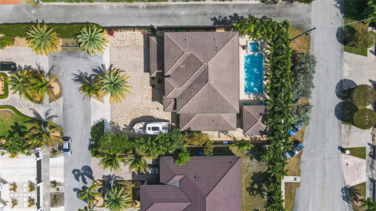 13676 Southwest 33rd Terrace Miami, FL 33175 - Photo 2 of 90 an aerial view of a house with a yard and a bench