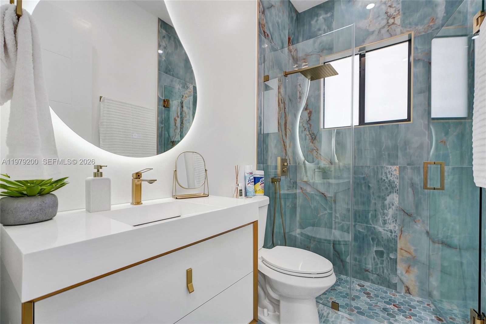 13676 Southwest 33rd Terrace Miami, FL 33175 - Photo 27 of 90 a bathroom with a sink mirror toilet and shower