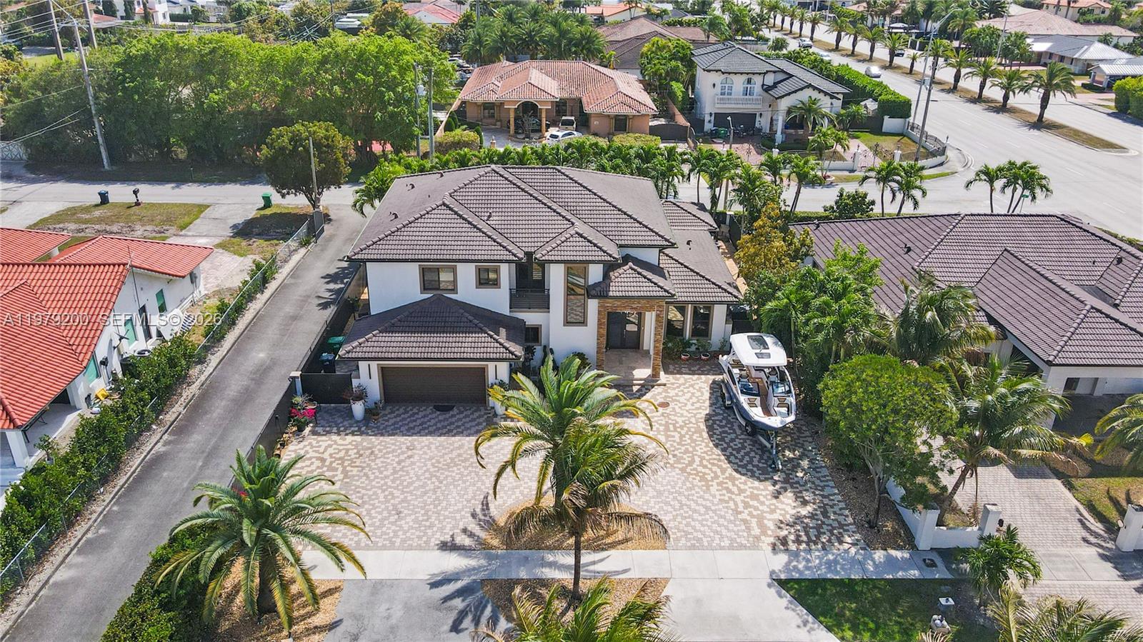 13676 Southwest 33rd Terrace Miami, FL 33175 - Photo 3 of 90 an aerial view of a house with garden space and lake view