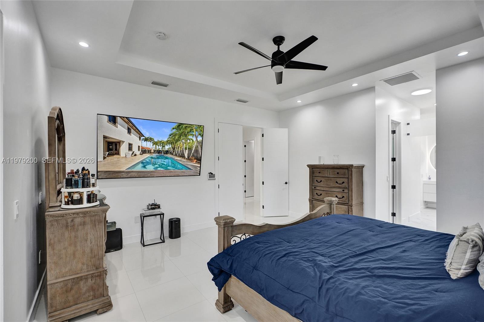 13676 Southwest 33rd Terrace Miami, FL 33175 - Photo 34 of 90 a bedroom with a bed and a flat screen tv