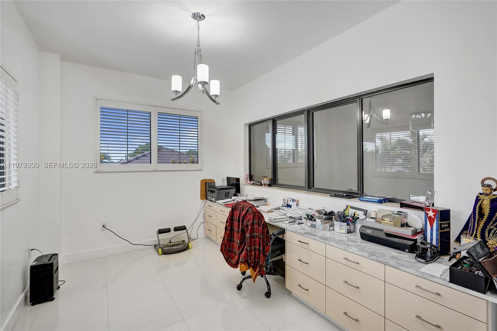 13676 Southwest 33rd Terrace Miami, FL 33175 - Photo 39 of 90 a view of a double vanity sink and a window