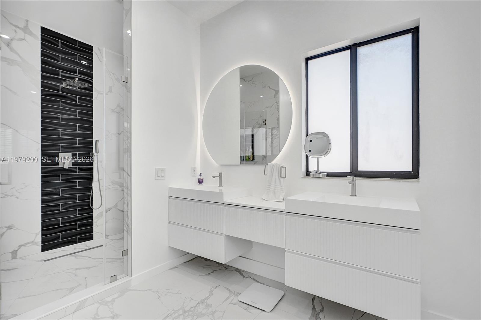 13676 Southwest 33rd Terrace Miami, FL 33175 - Photo 41 of 90 a bathroom with a double vanity sink and a mirror