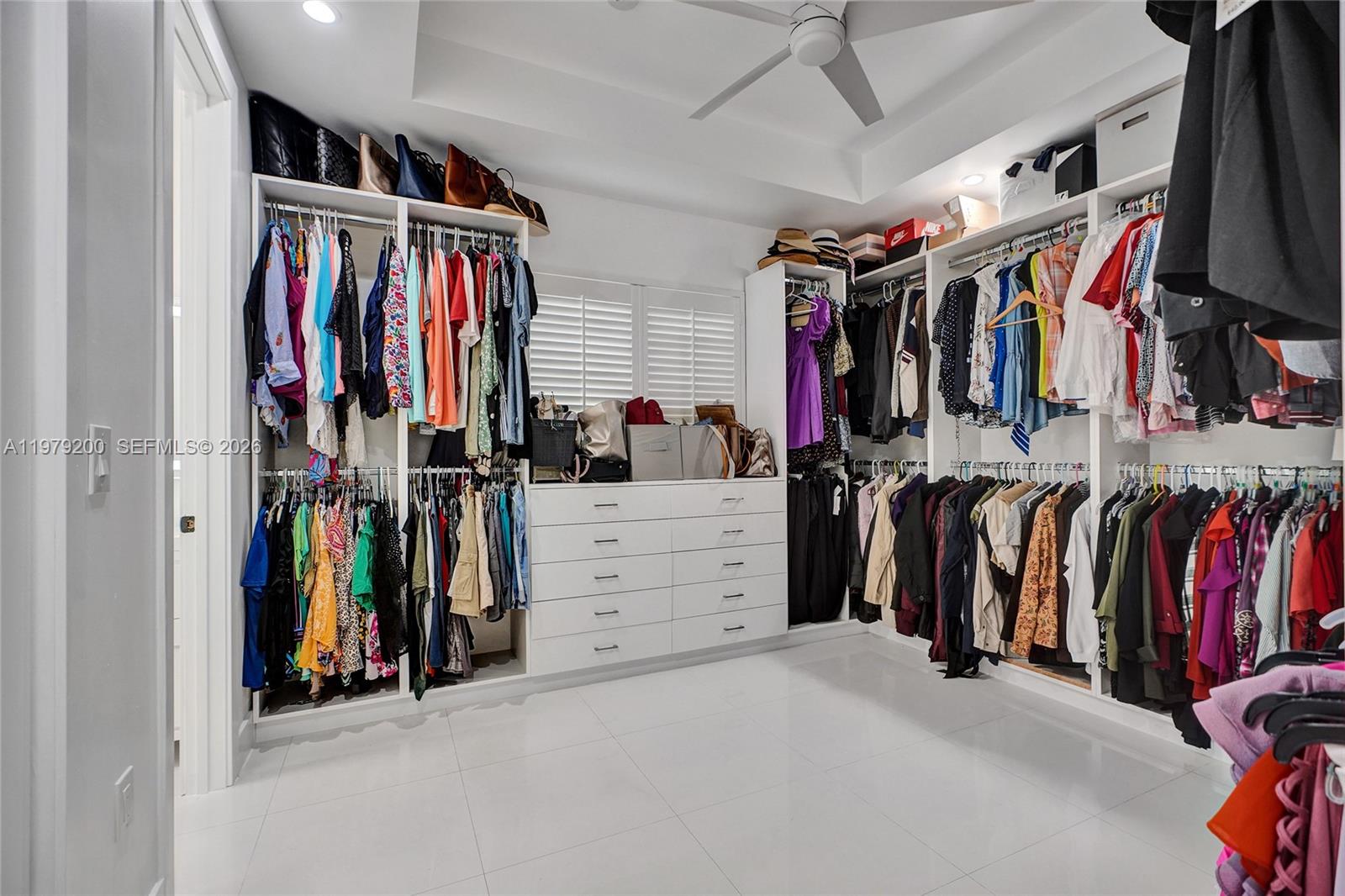 13676 Southwest 33rd Terrace Miami, FL 33175 - Photo 44 of 90 a view of walk in closet with clothes