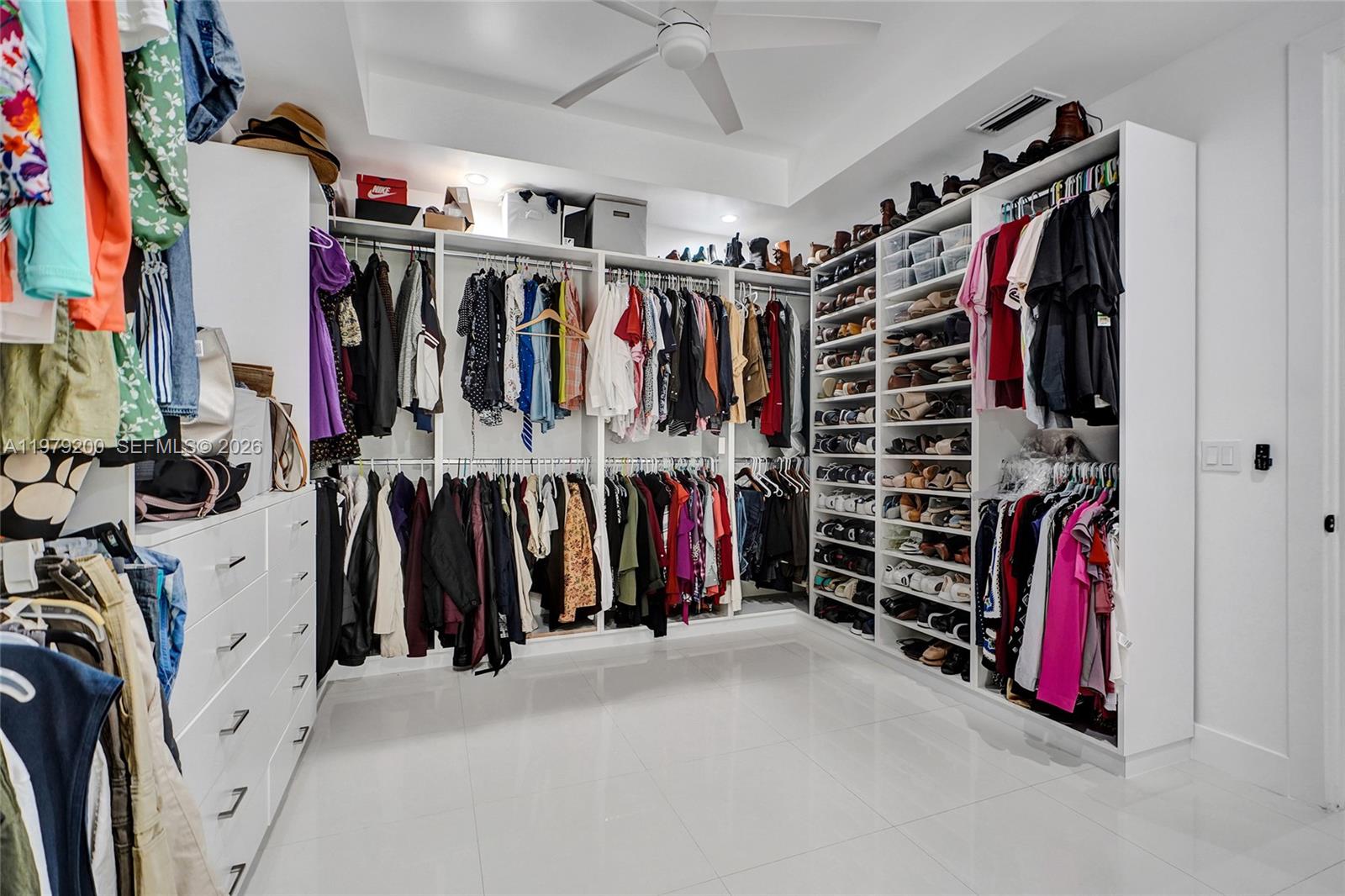 13676 Southwest 33rd Terrace Miami, FL 33175 - Photo 46 of 90 a view of walk in closet with clothes