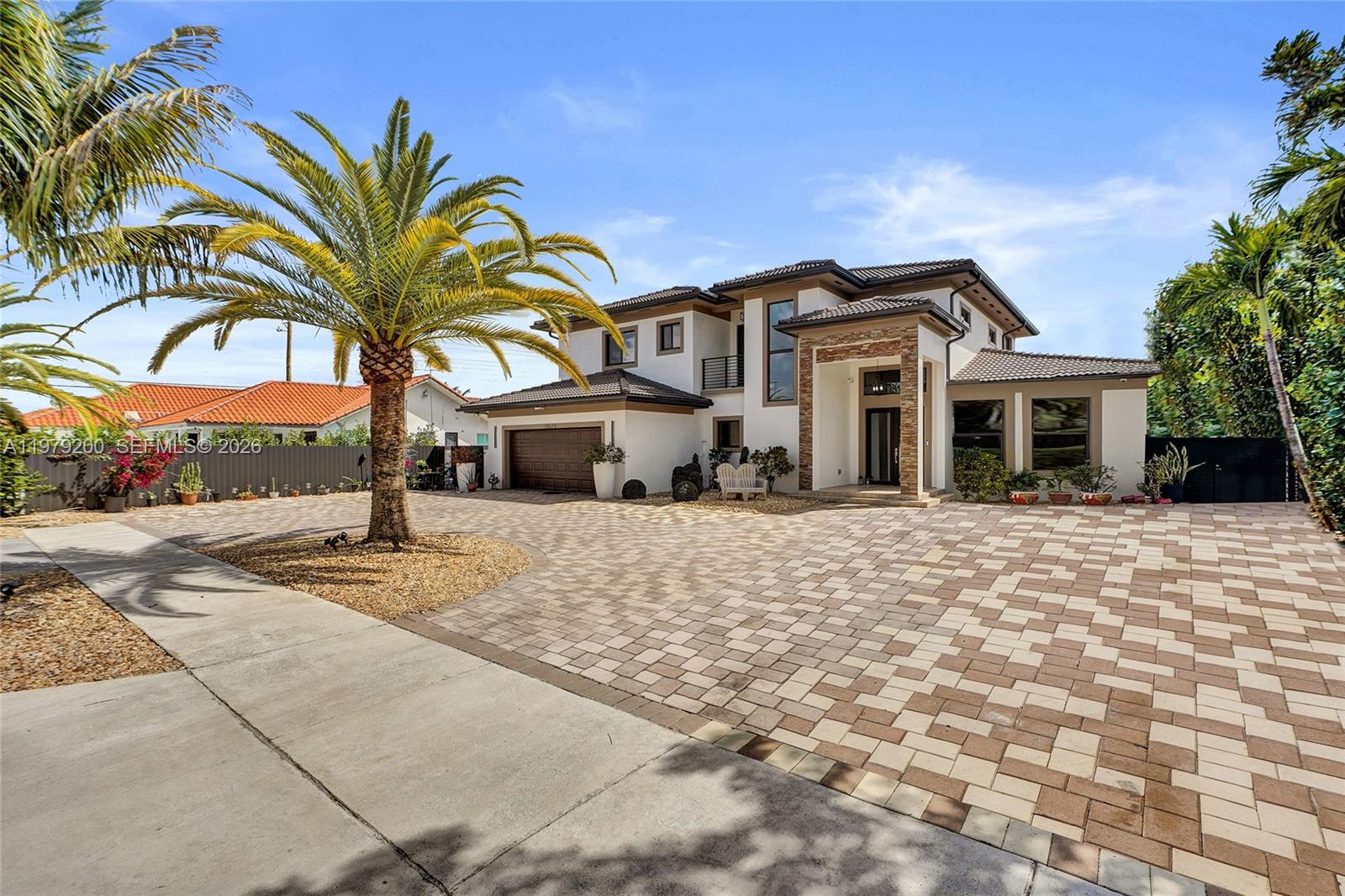 13676 Southwest 33rd Terrace Miami, FL 33175 - Photo 5 of 90 a front view of a house with a garden