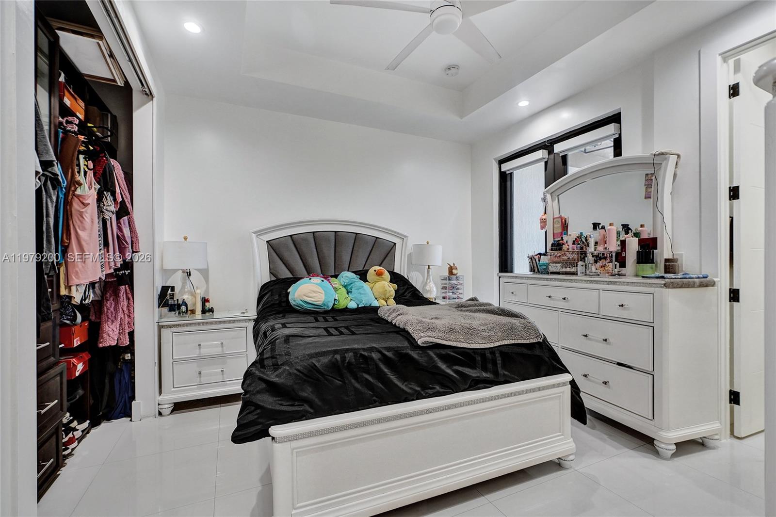 13676 Southwest 33rd Terrace Miami, FL 33175 - Photo 53 of 90 a bedroom with a bed and a painting on the wall