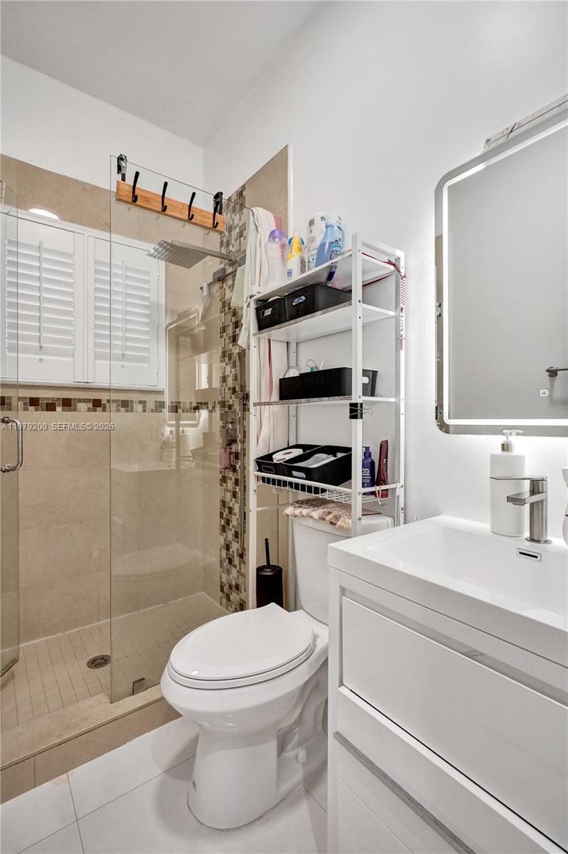 13676 Southwest 33rd Terrace Miami, FL 33175 - Photo 55 of 90 a bathroom with a sink a toilet and shower