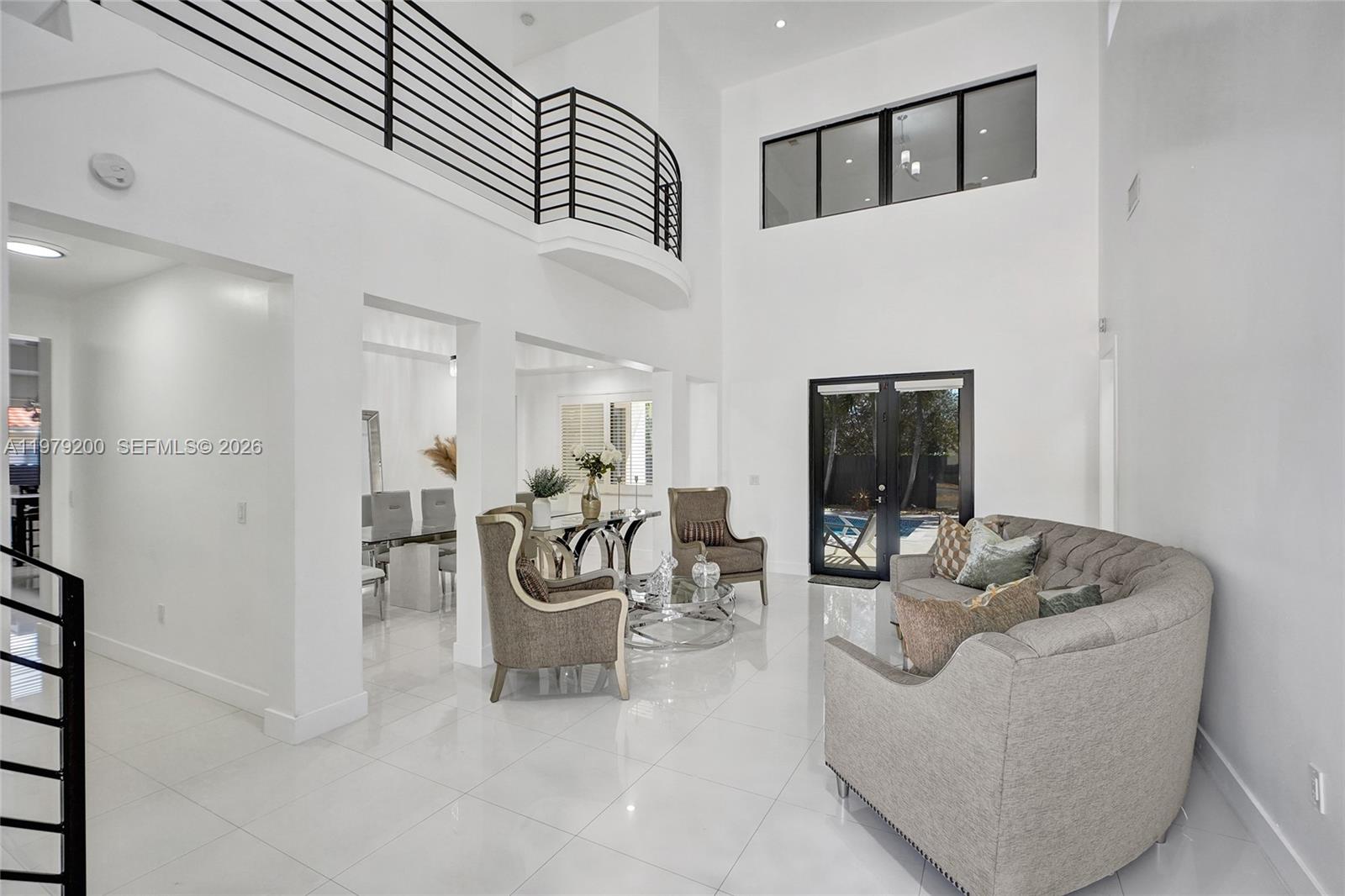 13676 Southwest 33rd Terrace Miami, FL 33175 - Photo 7 of 90 a living room with furniture and a flat screen tv