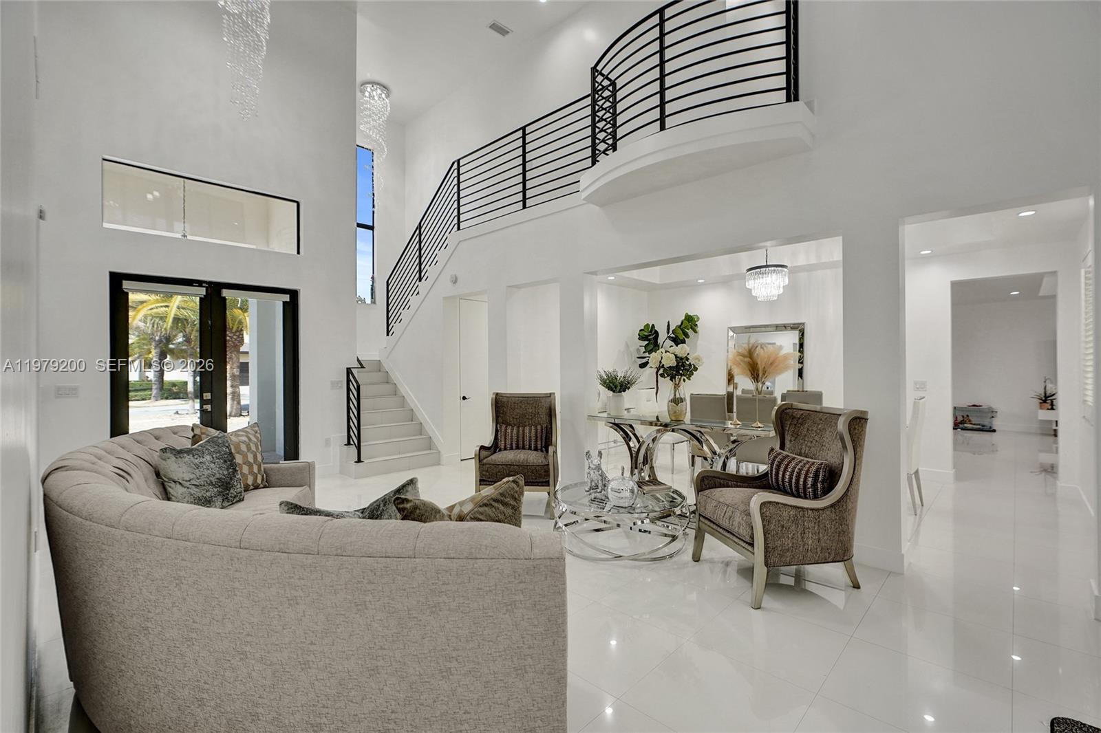 13676 Southwest 33rd Terrace Miami, FL 33175 - Photo 9 of 90 a living room with furniture and a chandelier