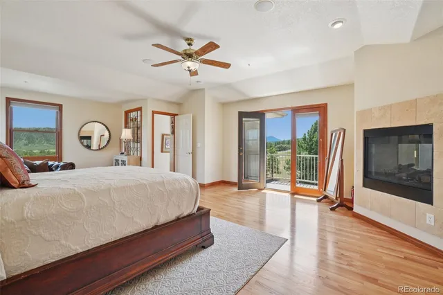 a bedroom with a large bed and a large window