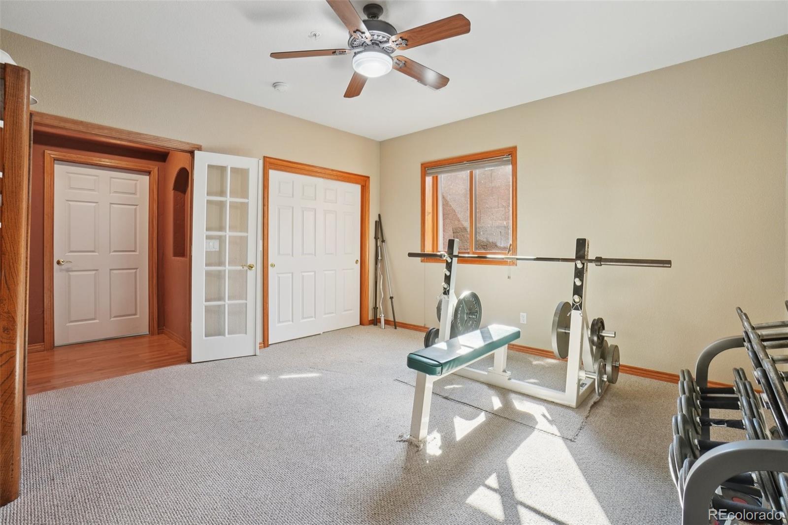 1475 Elk View Road Larkspur, CO 80118 - Photo 31 of 45 a view of a room with gym equipment