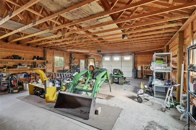 a room with storage and a table and chairs