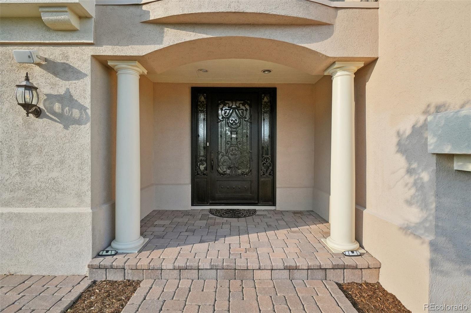 1475 Elk View Road Larkspur, CO 80118 - Photo 39 of 45 a view of a entryway door of the house