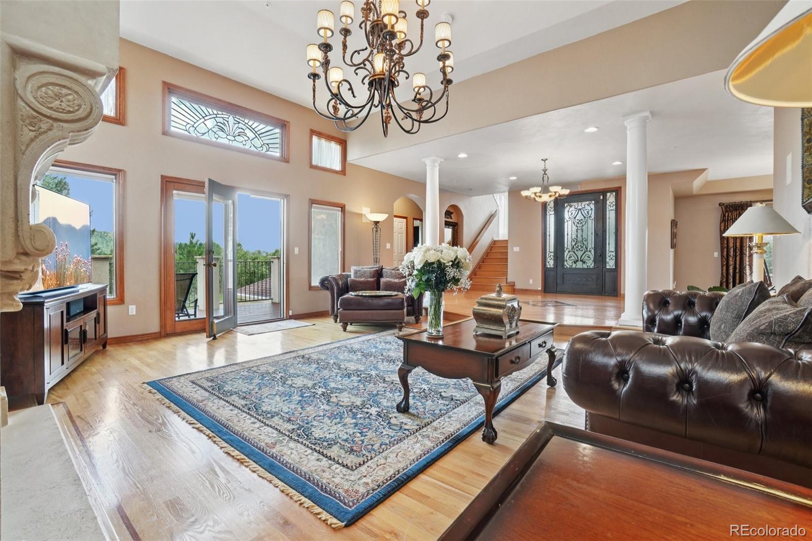 1475 Elk View Road Larkspur, CO 80118 - Photo 9 of 45 a living room with furniture