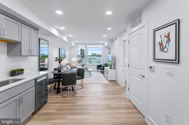 a kitchen with stainless steel appliances a stove a microwave and cabinets