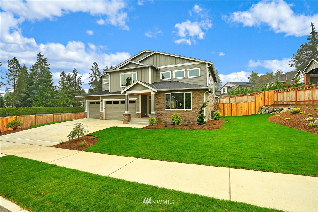 1430 236th Street Southeast Bothell, WA 98021 - Photo 2 of 38 a front view of a house with a yard
