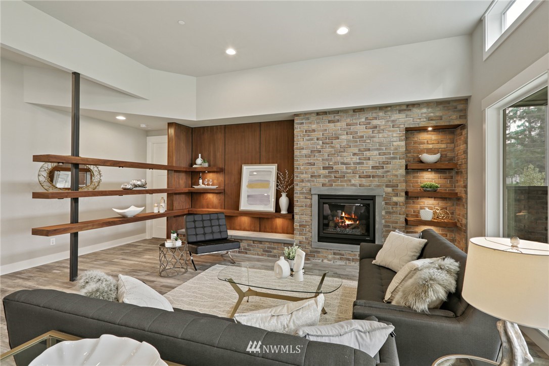 1430 236th Street Southeast Bothell, WA 98021 - Photo 12 of 38 a living room with furniture and a fireplace