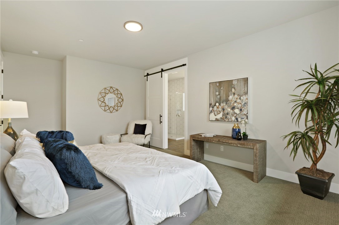 1430 236th Street Southeast Bothell, WA 98021 - Photo 29 of 38 a bedroom with a bed and a couch