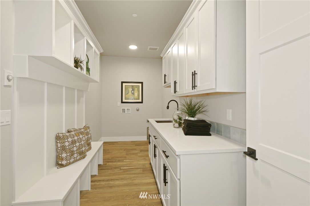 1430 236th Street Southeast Bothell, WA 98021 - Photo 34 of 38 a kitchen with a cabinets and window