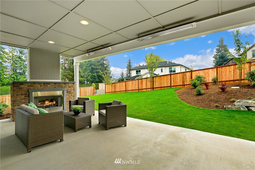 1430 236th Street Southeast Bothell, WA 98021 - Photo 36 of 38 a view of a patio with couches potted plants and a yard