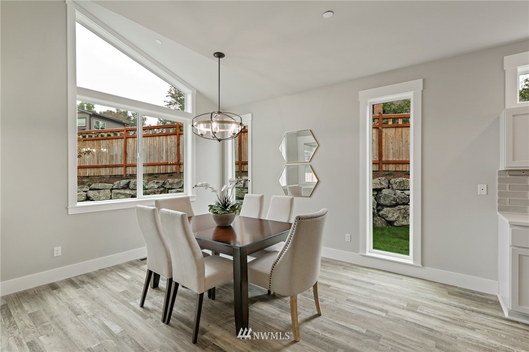 1430 236th Street Southeast Bothell, WA 98021 - Photo 8 of 38 a view of a dining room with furniture and window