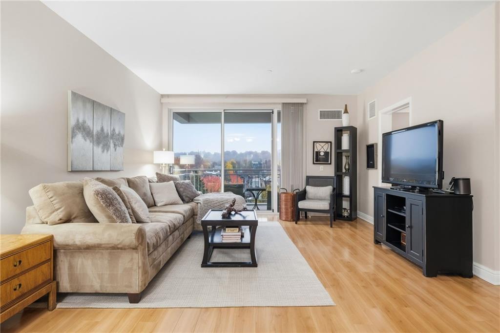 5570 Centre Avenue, Unit 400 Pittsburgh, PA 15232 - Photo 11 of 28 a living room with furniture and a flat screen tv