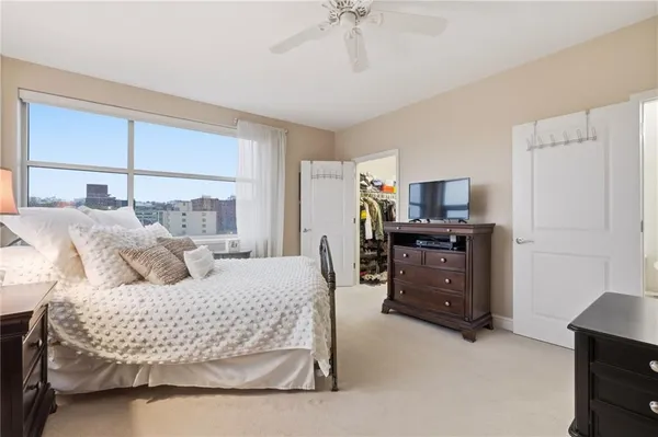 a bedroom with bed and window