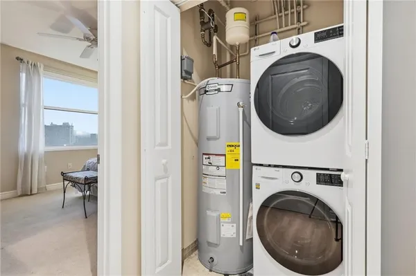 a view of a hallway with washer and dryer