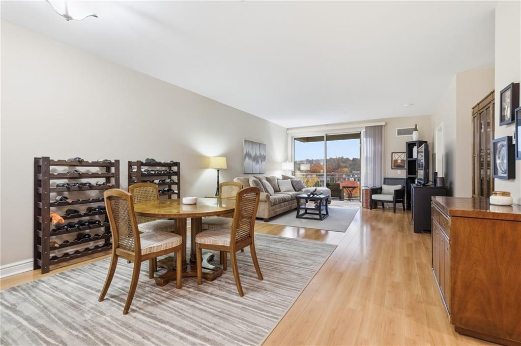 5570 Centre Avenue, Unit 400 Pittsburgh, PA 15232 - Photo 10 of 28 a living room with furniture a wooden floor and next to a window