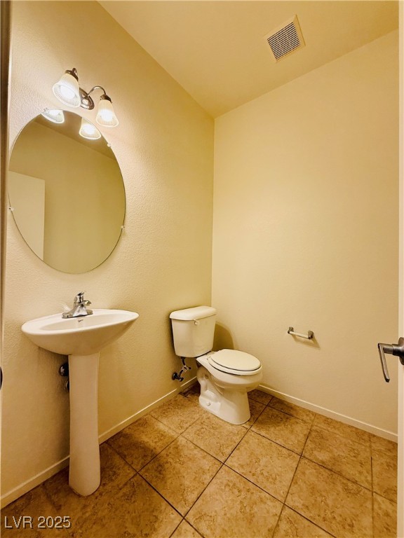 9342 Winebrook Avenue Las Vegas, NV 89148 - Photo 12 of 32 Bathroom with baseboards and light tile patterned floors