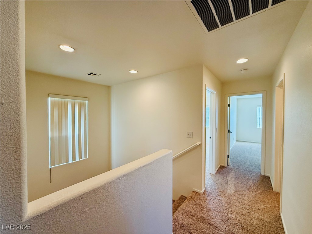 9342 Winebrook Avenue Las Vegas, NV 89148 - Photo 13 of 32 Hall with an upstairs landing, carpet flooring, and recessed lighting