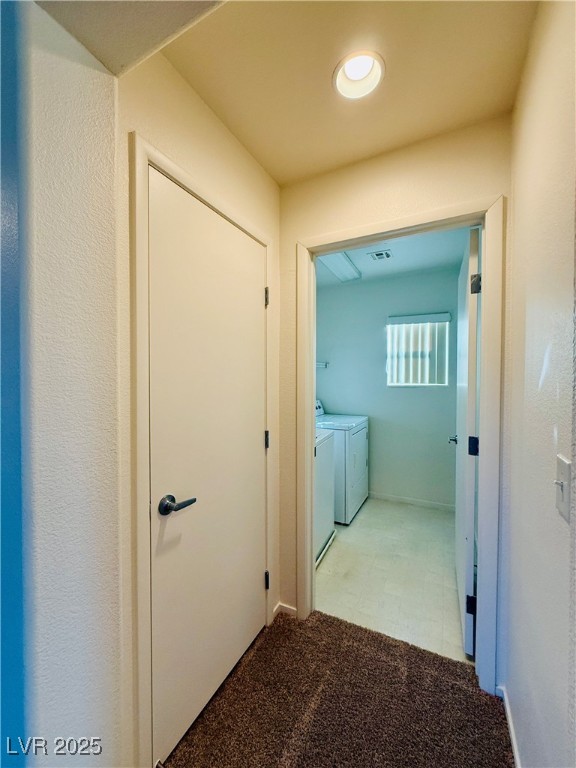 9342 Winebrook Avenue Las Vegas, NV 89148 - Photo 21 of 32 Hallway with light colored carpet and separate washer and dryer