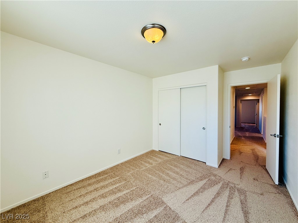 9342 Winebrook Avenue Las Vegas, NV 89148 - Photo 22 of 32 Unfurnished bedroom with carpet floors and a closet