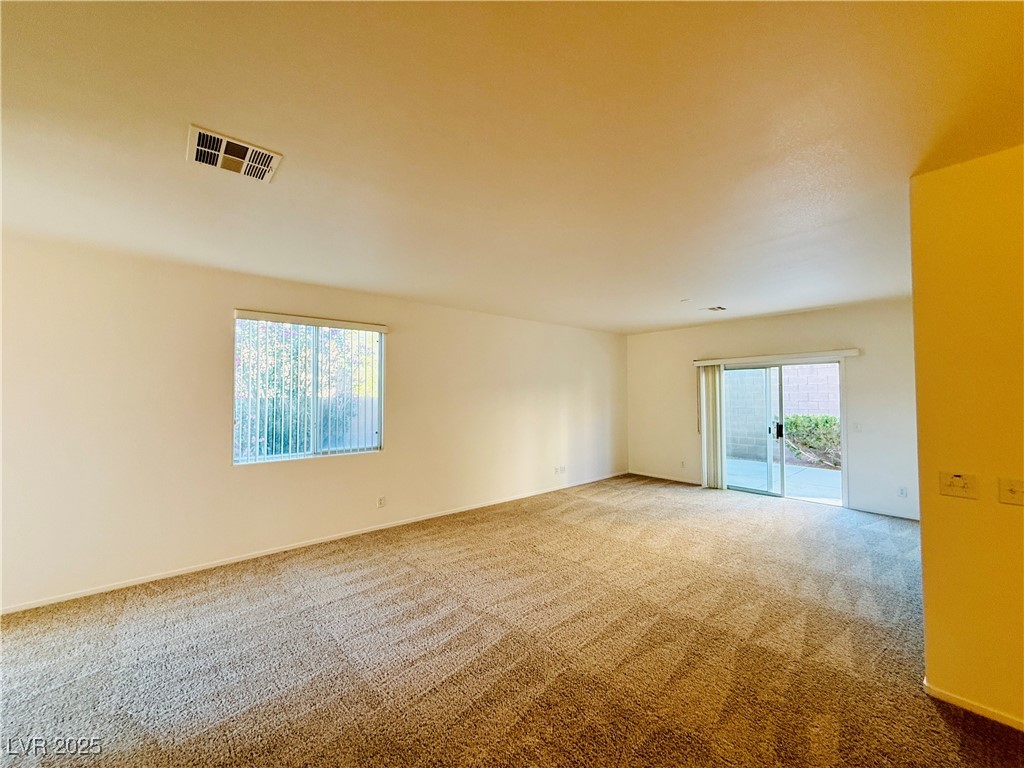 9342 Winebrook Avenue Las Vegas, NV 89148 - Photo 28 of 32 Carpeted spare room featuring baseboards